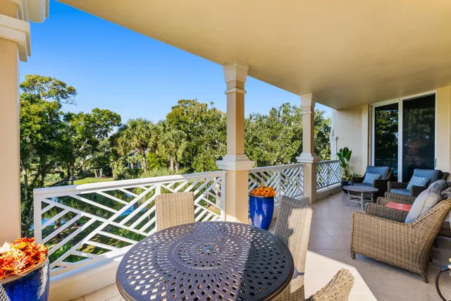 a living room with furniture fireplace and a window