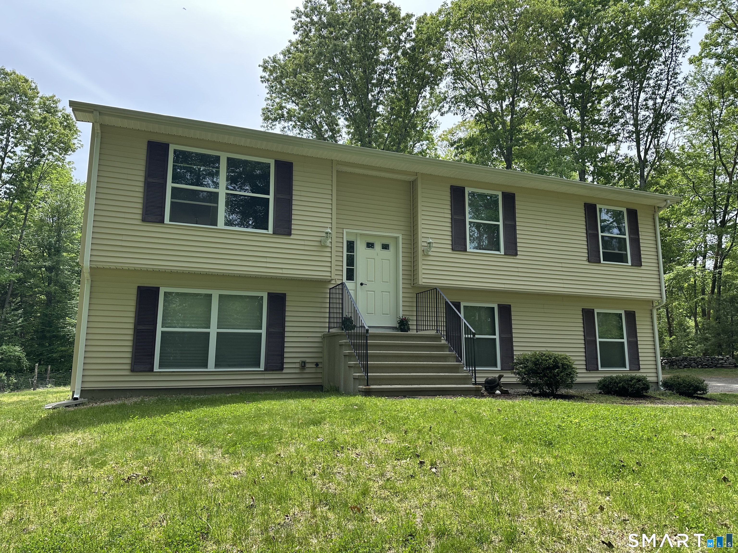 116 Tatnic Hill Road Brooklyn, CT 06234 - Photo 1 of 27 a view of a house with a yard and large windows