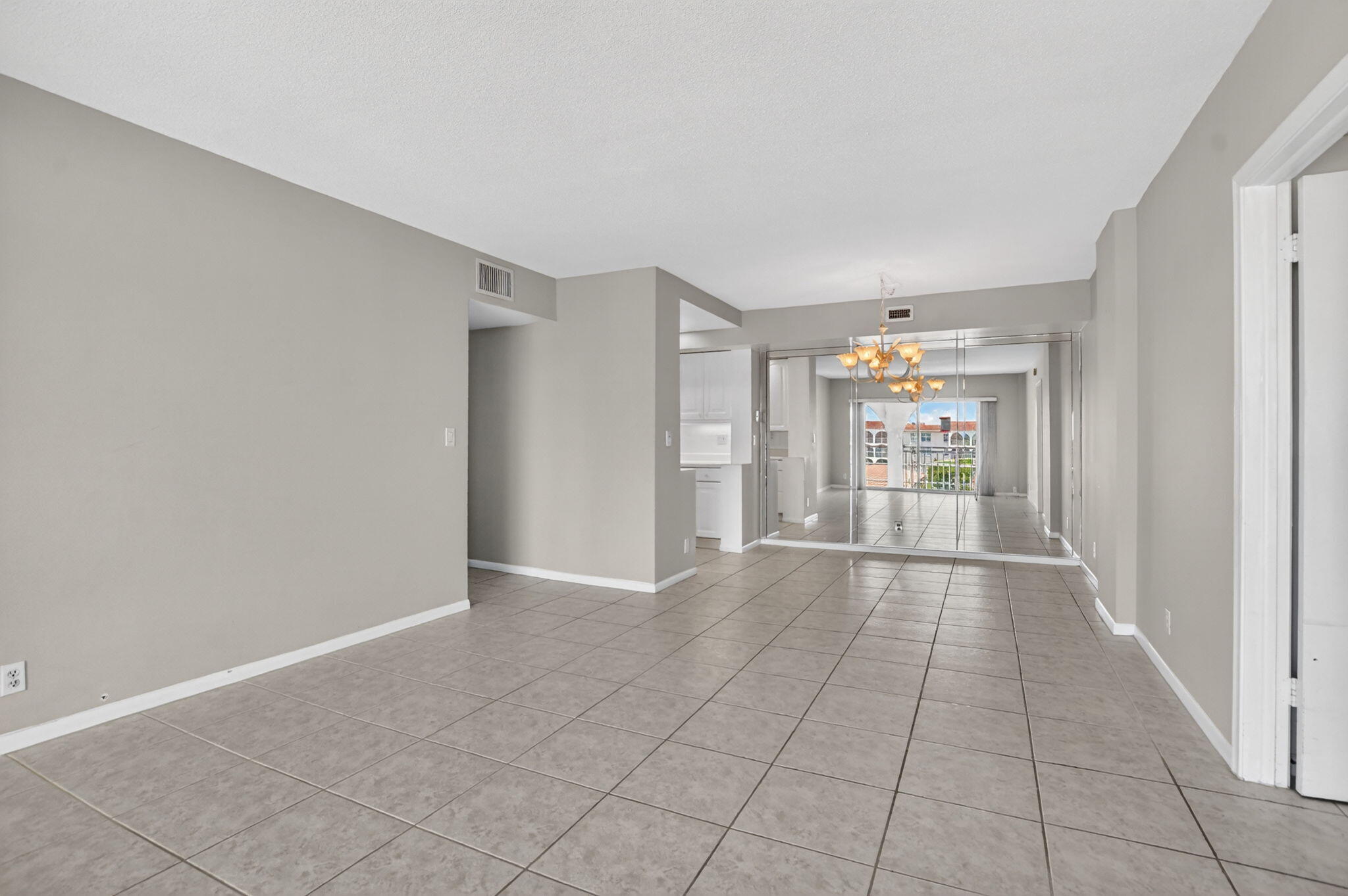 250 Northeast 20th Street, Unit 5220 Boca Raton, FL 33431 - Photo 12 of 40 a view of hallway with a couch and a window