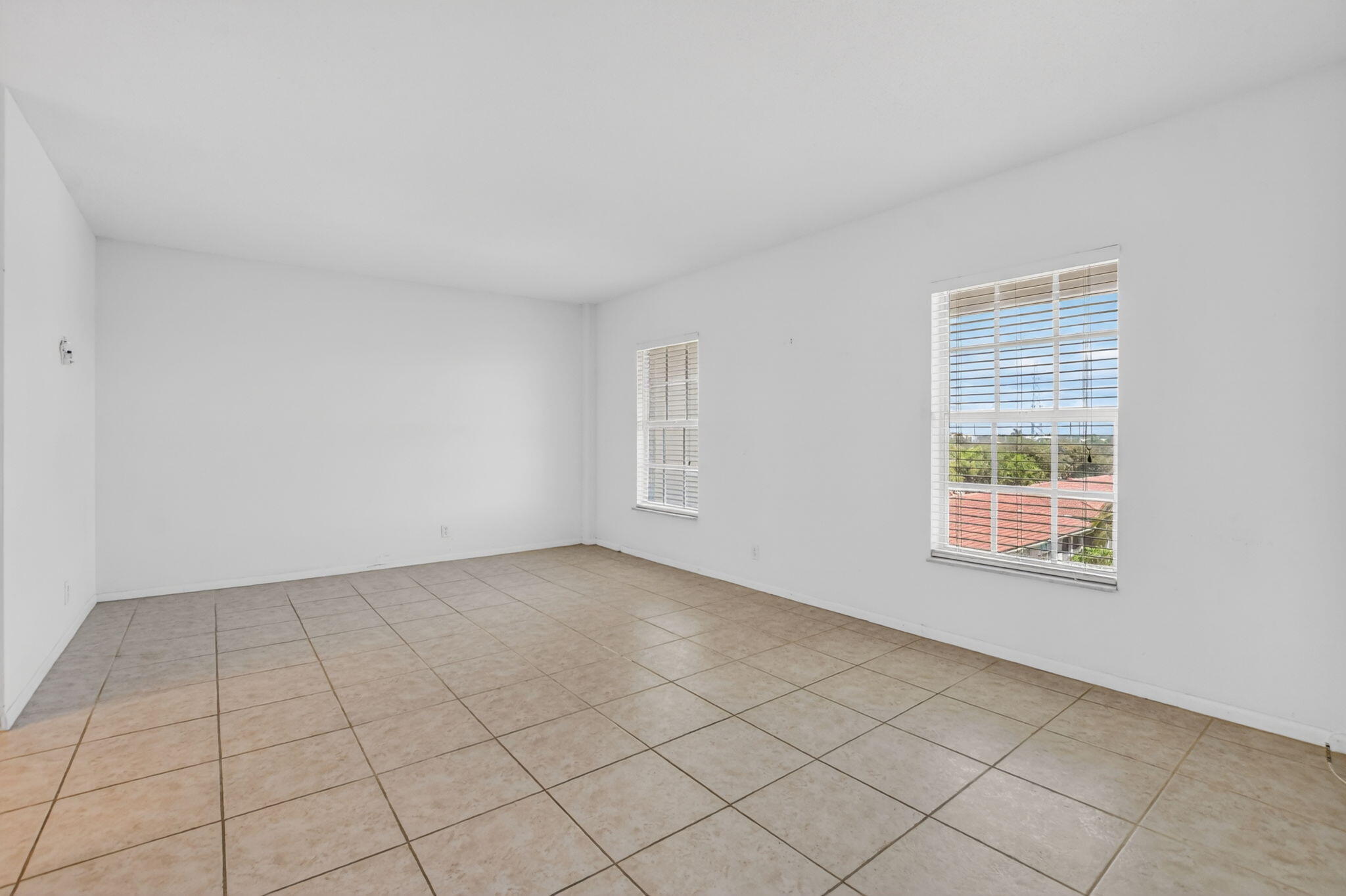 250 Northeast 20th Street, Unit 5220 Boca Raton, FL 33431 - Photo 13 of 40 an empty room with windows
