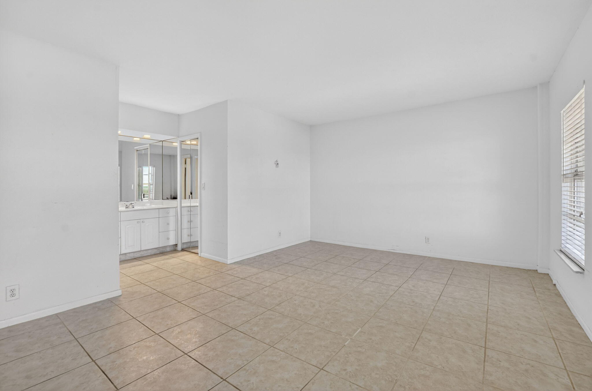 250 Northeast 20th Street, Unit 5220 Boca Raton, FL 33431 - Photo 14 of 40 an empty room with windows
