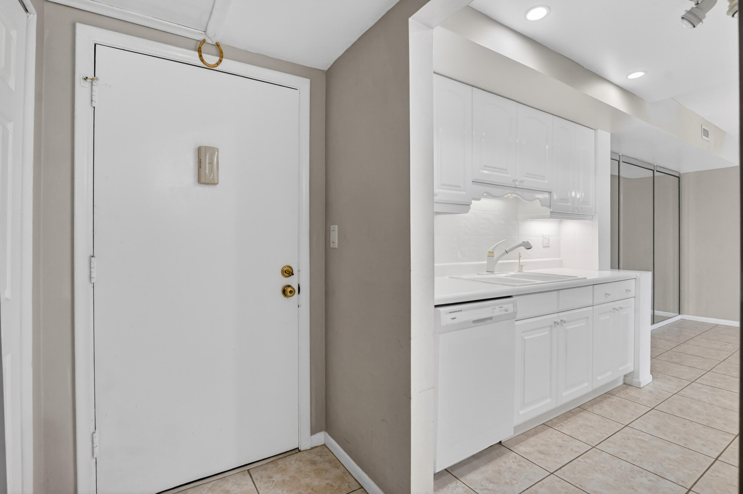 250 Northeast 20th Street, Unit 5220 Boca Raton, FL 33431 - Photo 2 of 40 a bathroom with a granite countertop sink mirror and vanity