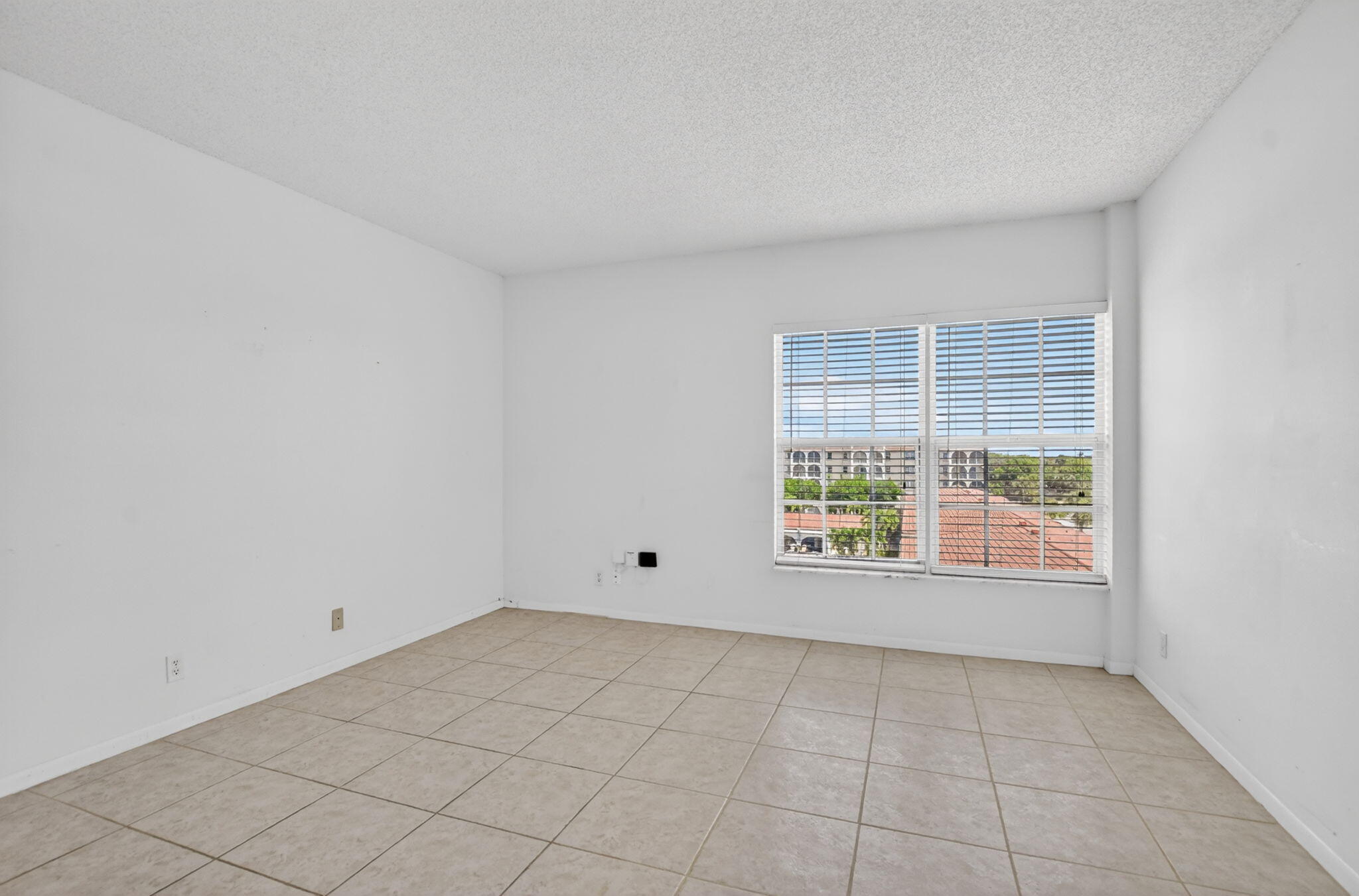 250 Northeast 20th Street, Unit 5220 Boca Raton, FL 33431 - Photo 22 of 40 a view of an empty room with a window
