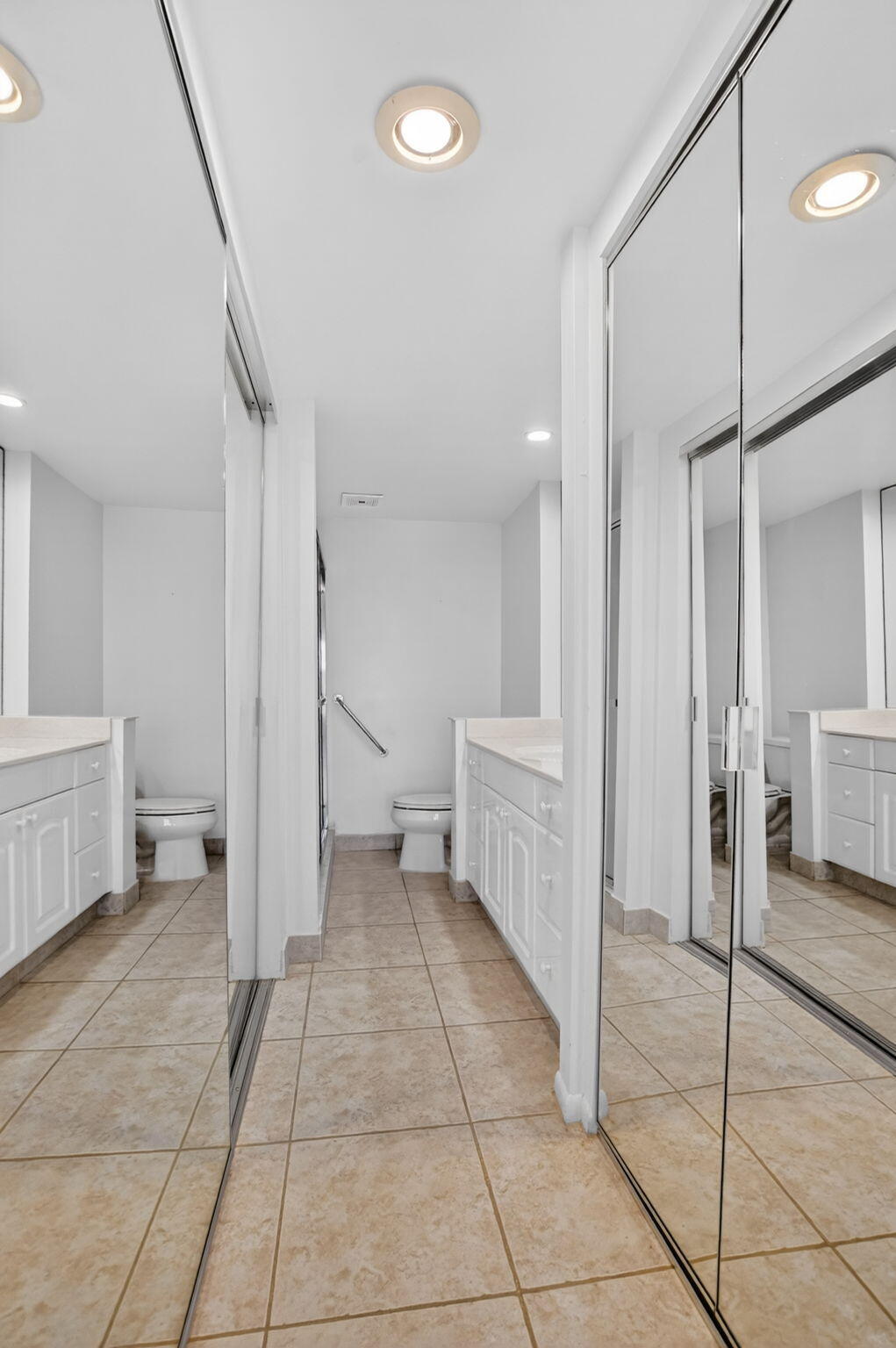 250 Northeast 20th Street, Unit 5220 Boca Raton, FL 33431 - Photo 23 of 40 a bathroom with a sink and a mirror