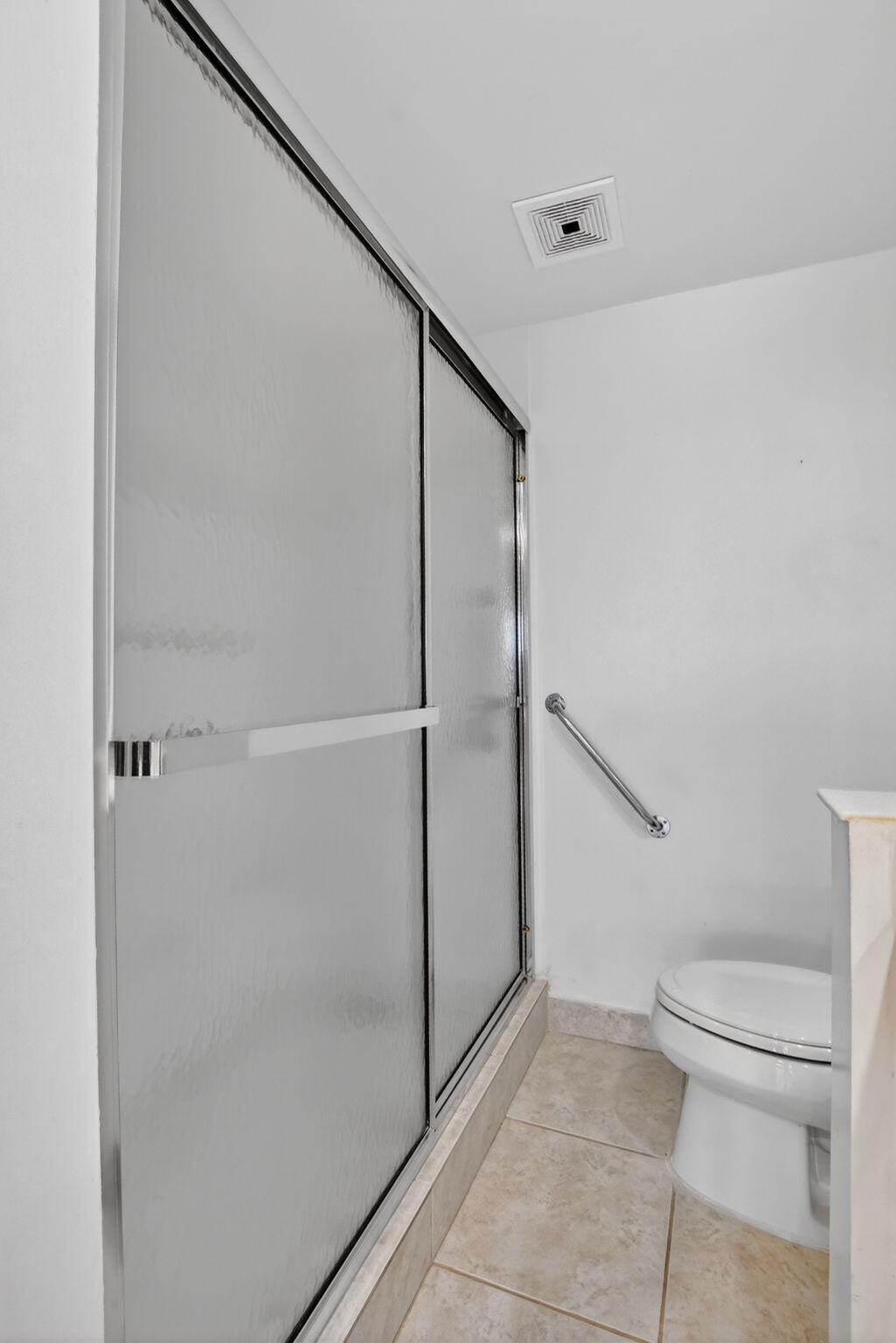 250 Northeast 20th Street, Unit 5220 Boca Raton, FL 33431 - Photo 24 of 40 a bathroom with a shower and toilet