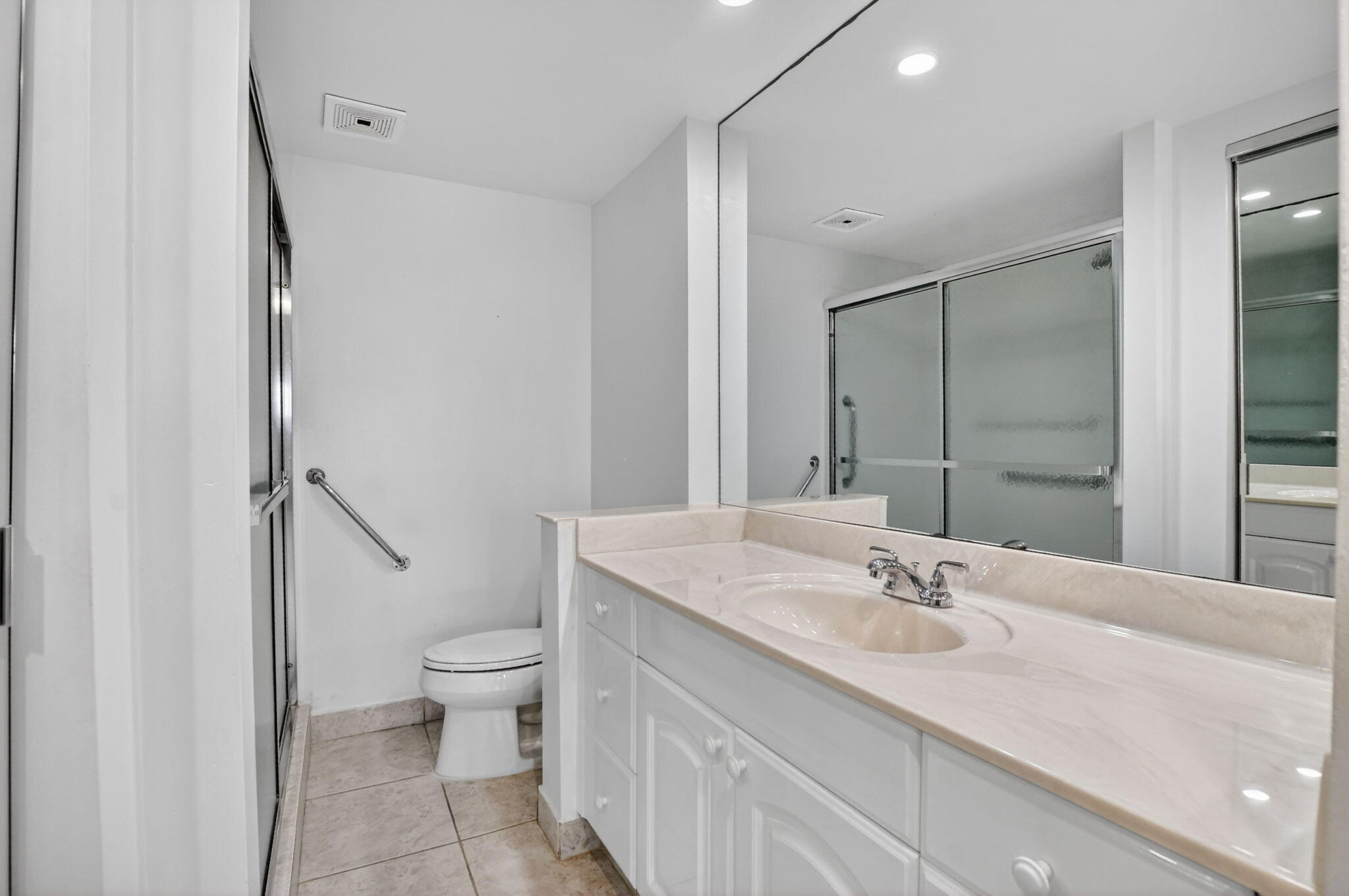 250 Northeast 20th Street, Unit 5220 Boca Raton, FL 33431 - Photo 25 of 40 a bathroom with a sink toilet and shower
