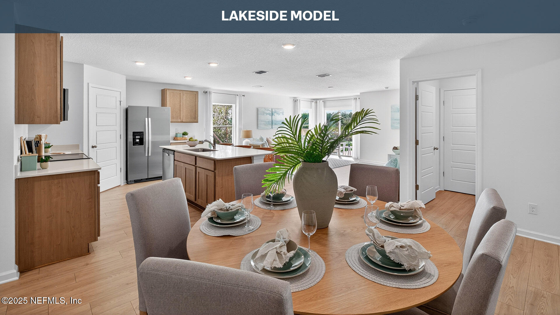 12390 Great Eagle Road Jacksonville, FL 32219 - Photo 6 of 69 a view of a dining room with furniture a kitchen and chandelier