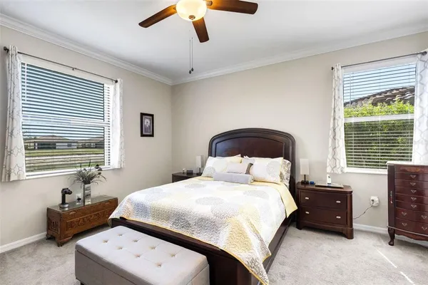 a bedroom with a bed and window