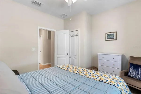 a bedroom with a bed and a dresser
