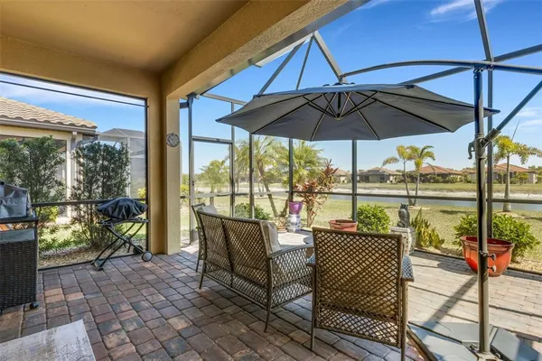 a view of a chair and tables in the patio