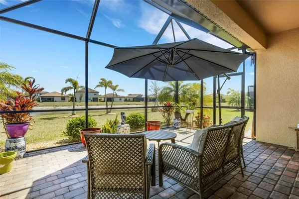 a swimming pool with outdoor seating yard and mountain view