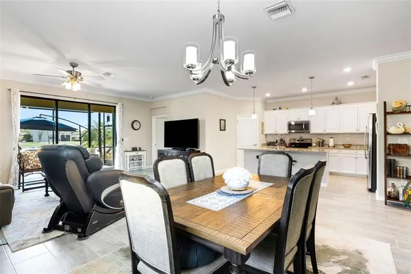 a view of a dining room with furniture window and outside view