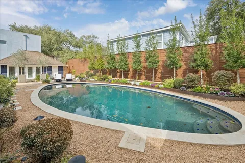 a view of a house with a backyard porch and sitting area