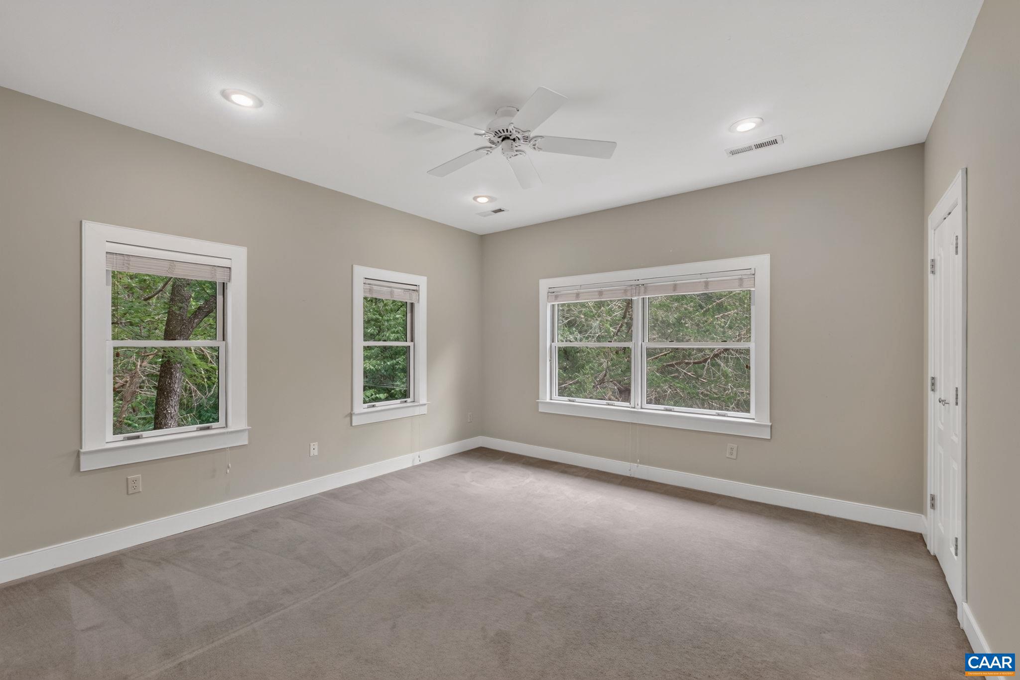 6285 Jarmans Gap Road Crozet, VA 22932 - Photo 23 of 65 an empty room with a window and a ceiling fan