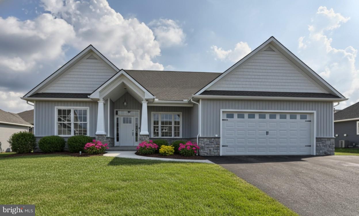 18 Rolling Meadow Road Lebanon, PA 17046 - Photo 1 of 35 a front view of a house with a yard and garage