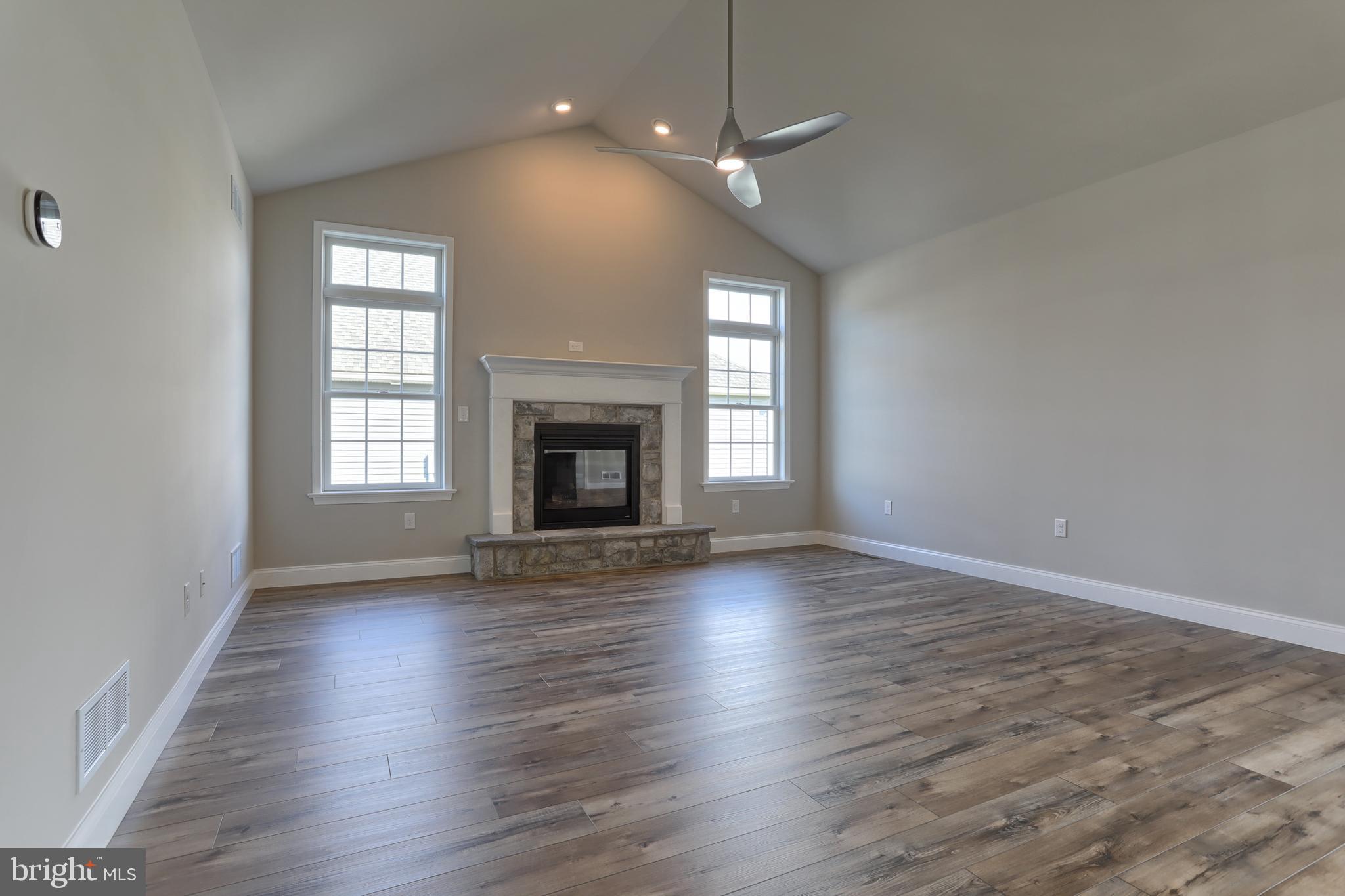 18 Rolling Meadow Road Lebanon, PA 17046 - Photo 12 of 35 an empty room with wooden floor fireplace and window