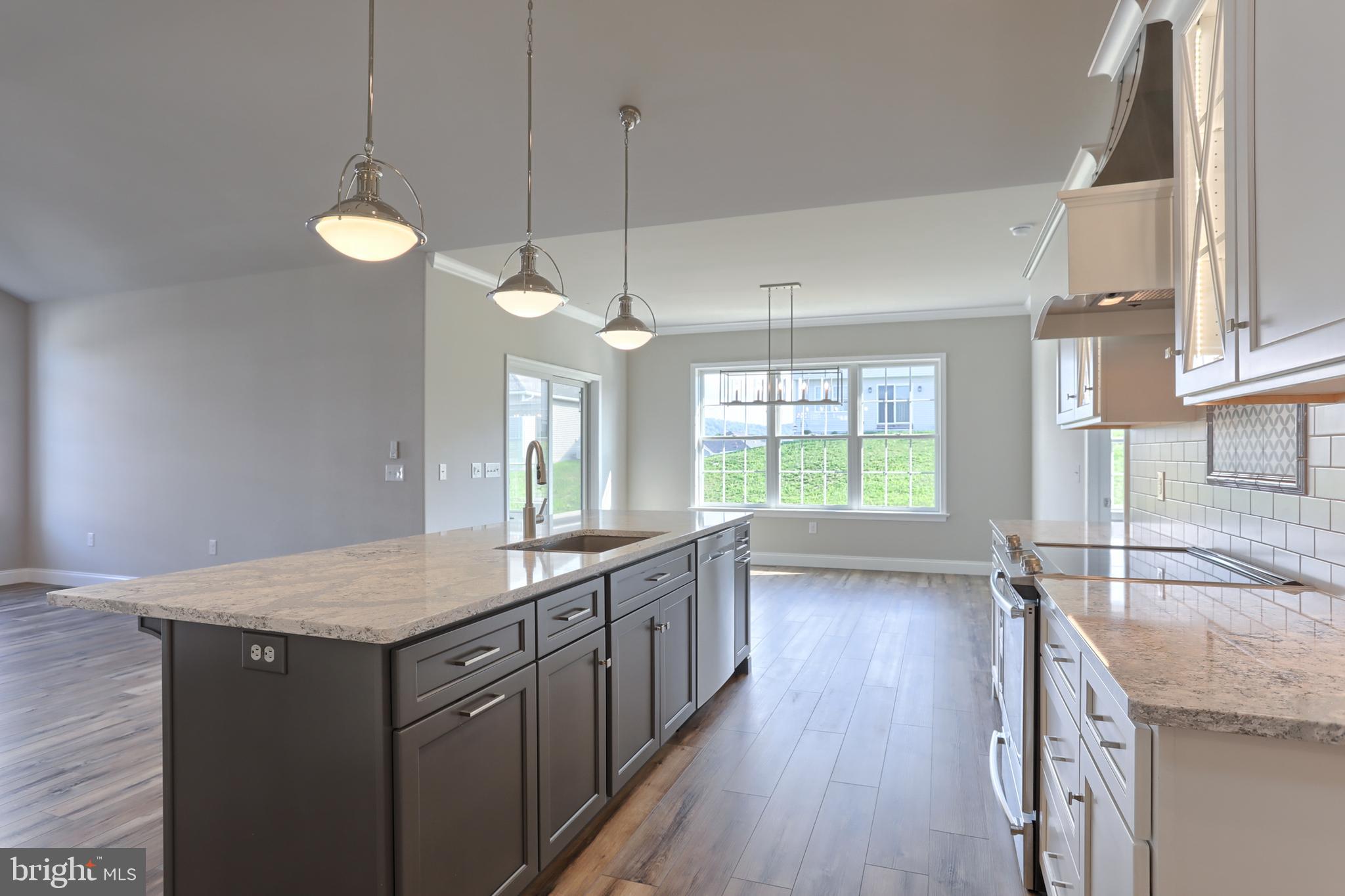 18 Rolling Meadow Road Lebanon, PA 17046 - Photo 17 of 35 a kitchen with granite countertop a sink a counter top space and living room view