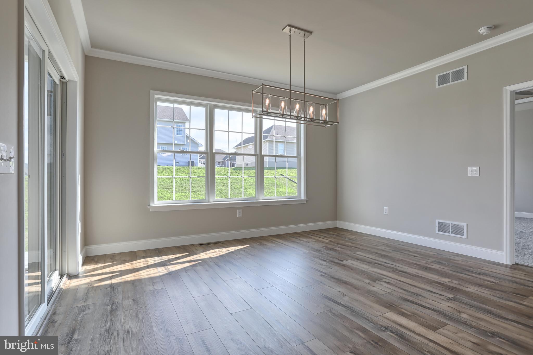 18 Rolling Meadow Road Lebanon, PA 17046 - Photo 20 of 35 a view of an empty room with wooden floor and a window