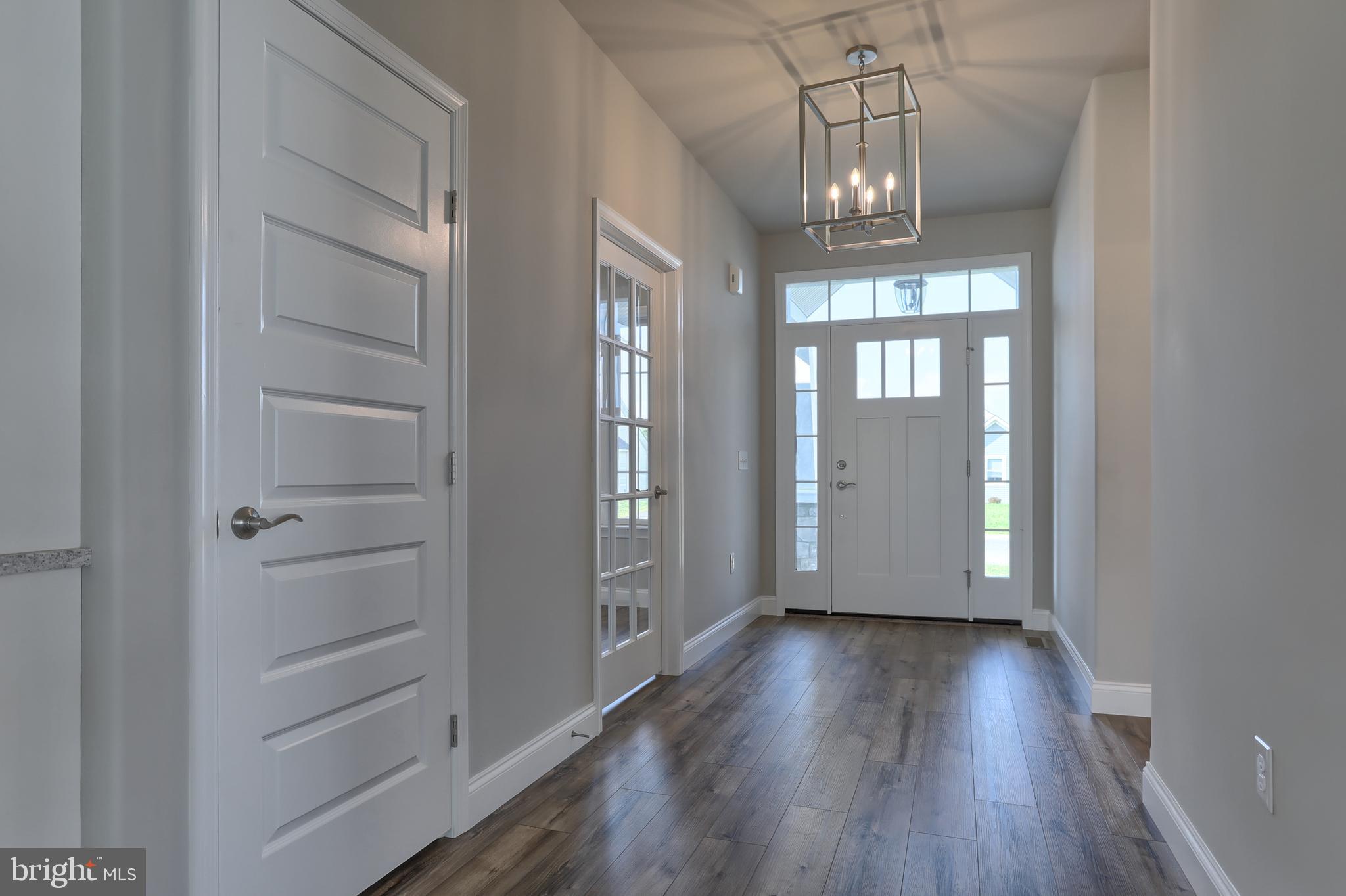 18 Rolling Meadow Road Lebanon, PA 17046 - Photo 2 of 35 wooden floor in an empty room with a window