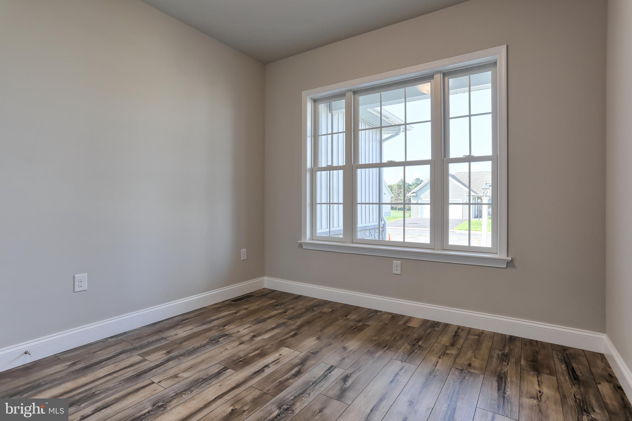 18 Rolling Meadow Road Lebanon, PA 17046 - Photo 5 of 35 an empty room with wooden floor and windows