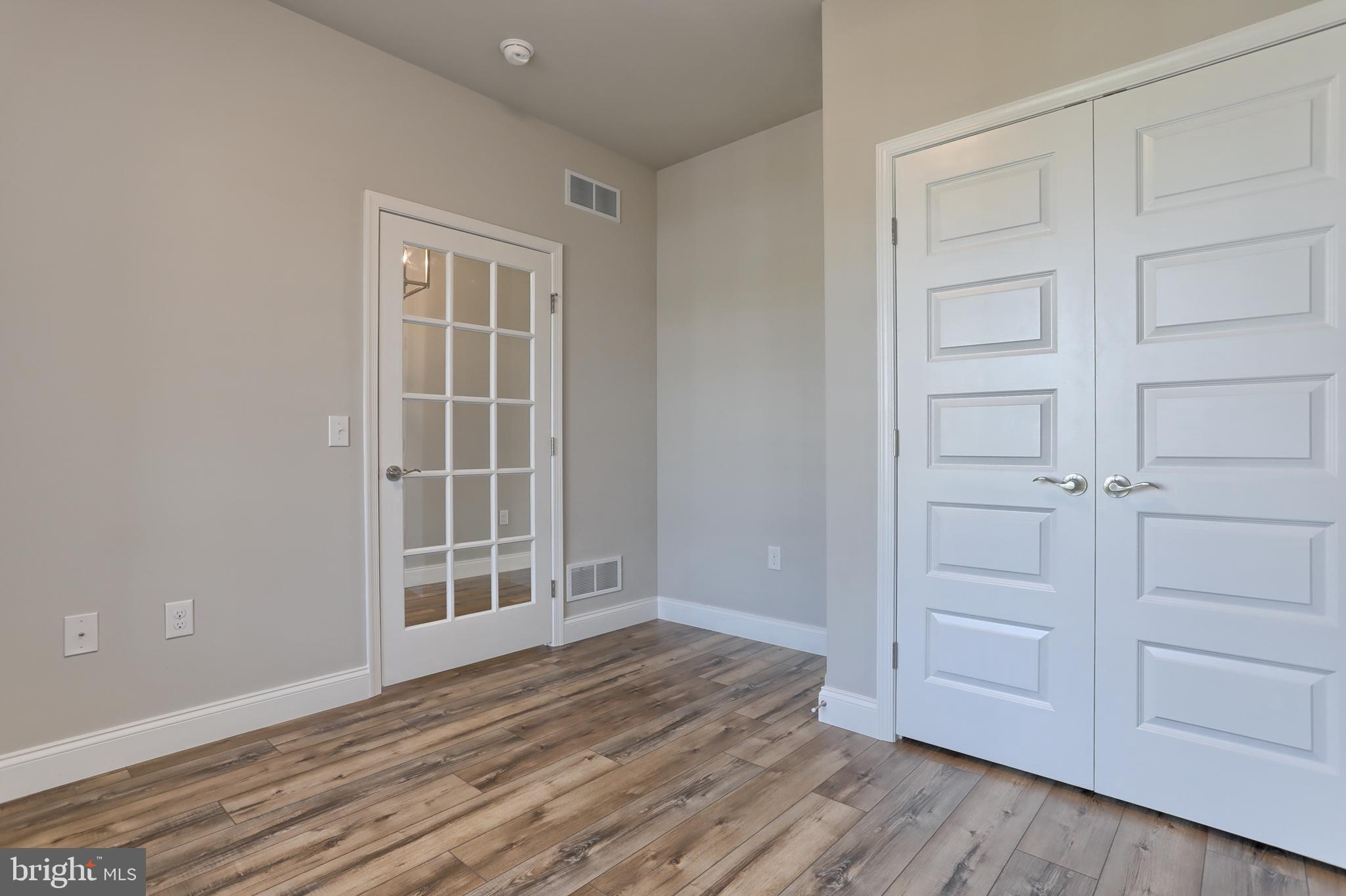 18 Rolling Meadow Road Lebanon, PA 17046 - Photo 6 of 35 an empty room with wooden floor closet and windows