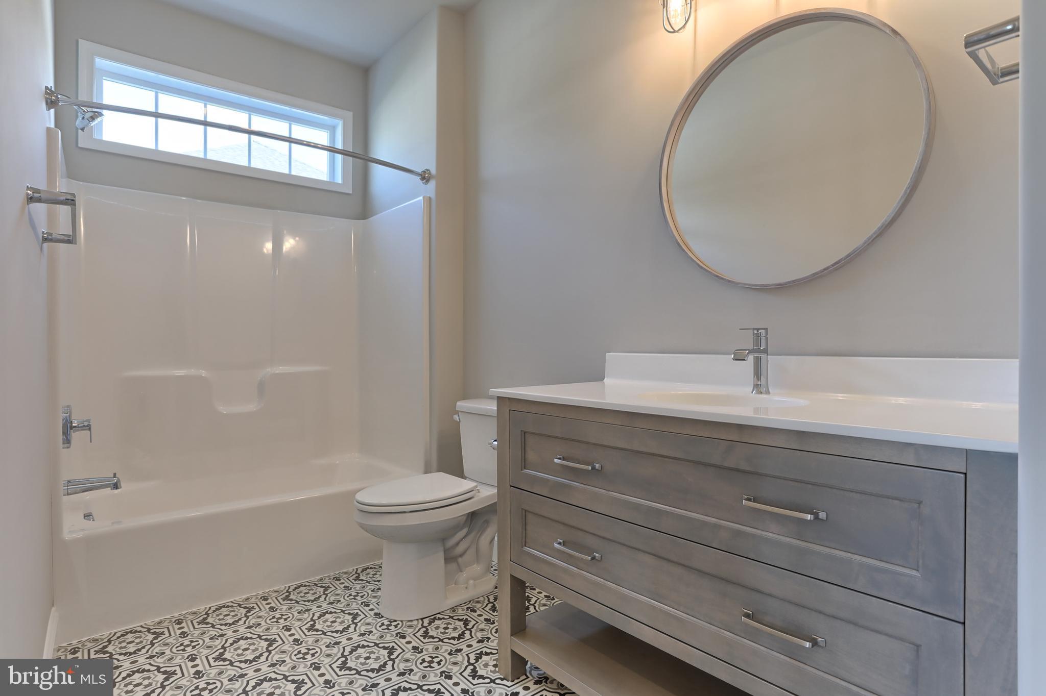 18 Rolling Meadow Road Lebanon, PA 17046 - Photo 8 of 35 a bathroom with a sink a toilet and a mirror