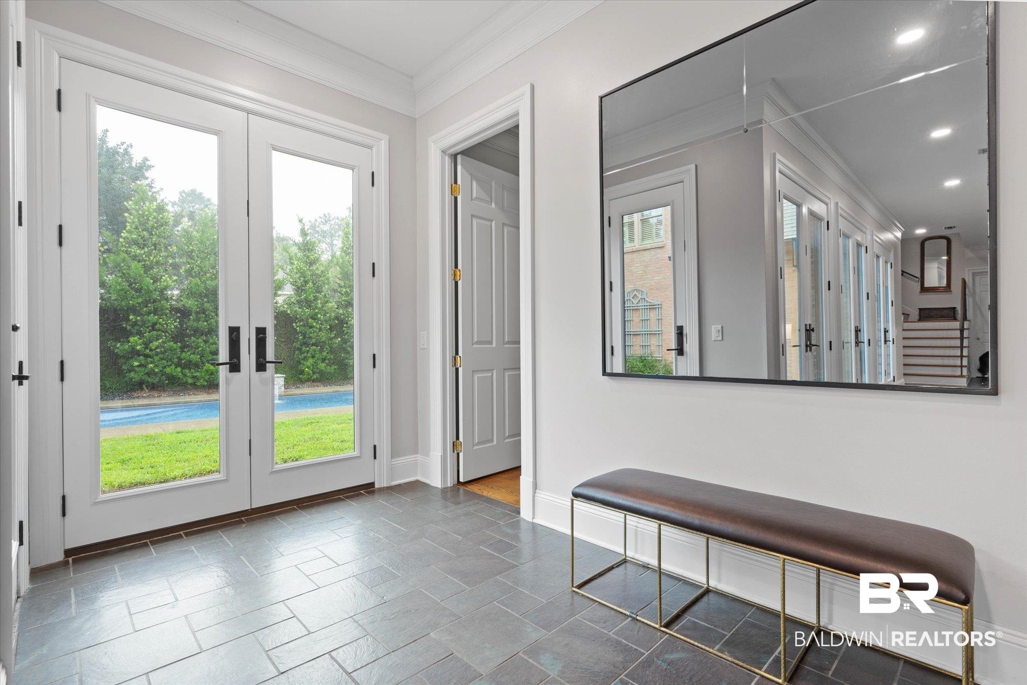 4008 McGregor Oaks Mobile, AL 36608 - Photo 20 of 50 Doorway to outside featuring ornamental molding, french doors, stone tile flooring, and recessed lighting