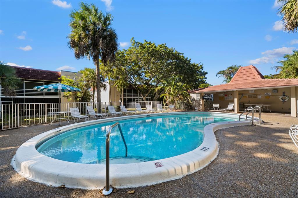 3511 Inverrary Drive, Unit 208 Lauderhill, FL 33319 - Photo 13 of 23 a view of a swimming pool with a patio