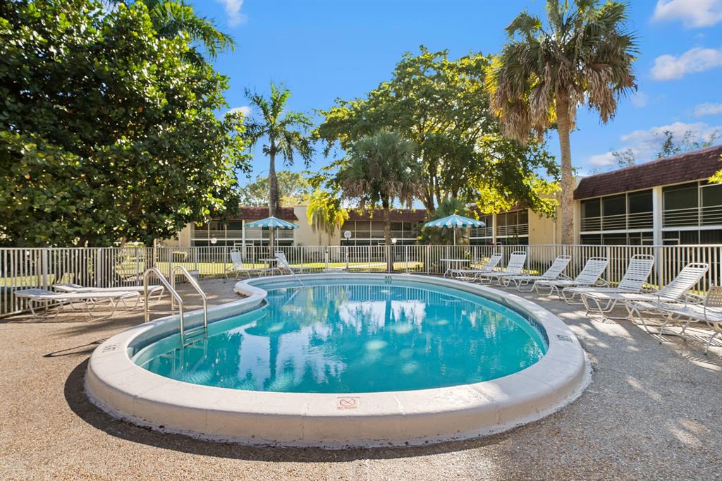 3511 Inverrary Drive, Unit 208 Lauderhill, FL 33319 - Photo 14 of 23 a view of a swimming pool with a patio