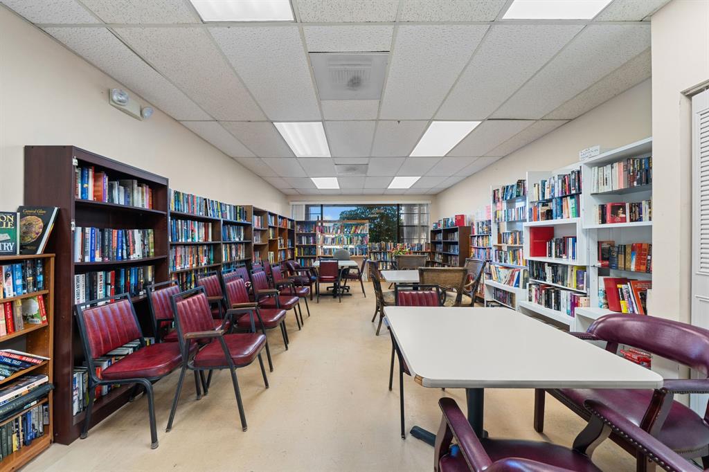 3511 Inverrary Drive, Unit 208 Lauderhill, FL 33319 - Photo 19 of 23 a view of a livingroom with furniture and a bookshelf