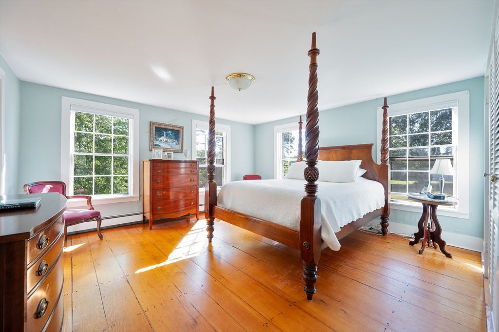 339 Boston Road Sutton, MA 01590 - Photo 18 of 28 a bedroom with a bed and wooden floor