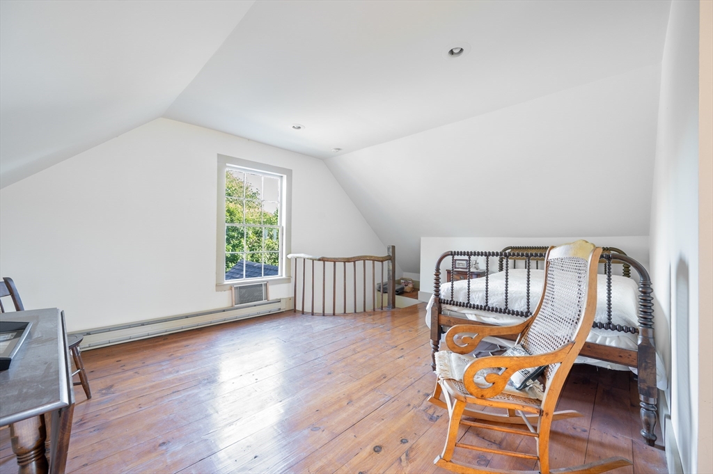 339 Boston Road Sutton, MA 01590 - Photo 22 of 28 a view of a room with wooden floor wooden floor and windows