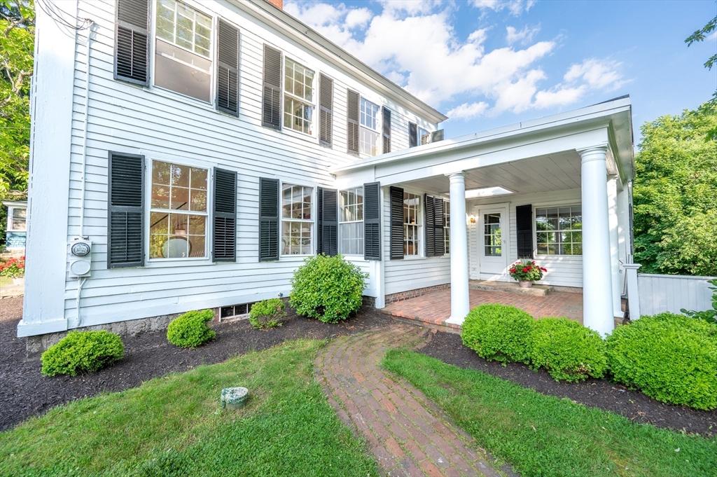 339 Boston Road Sutton, MA 01590 - Photo 24 of 28 a front view of a house with garden