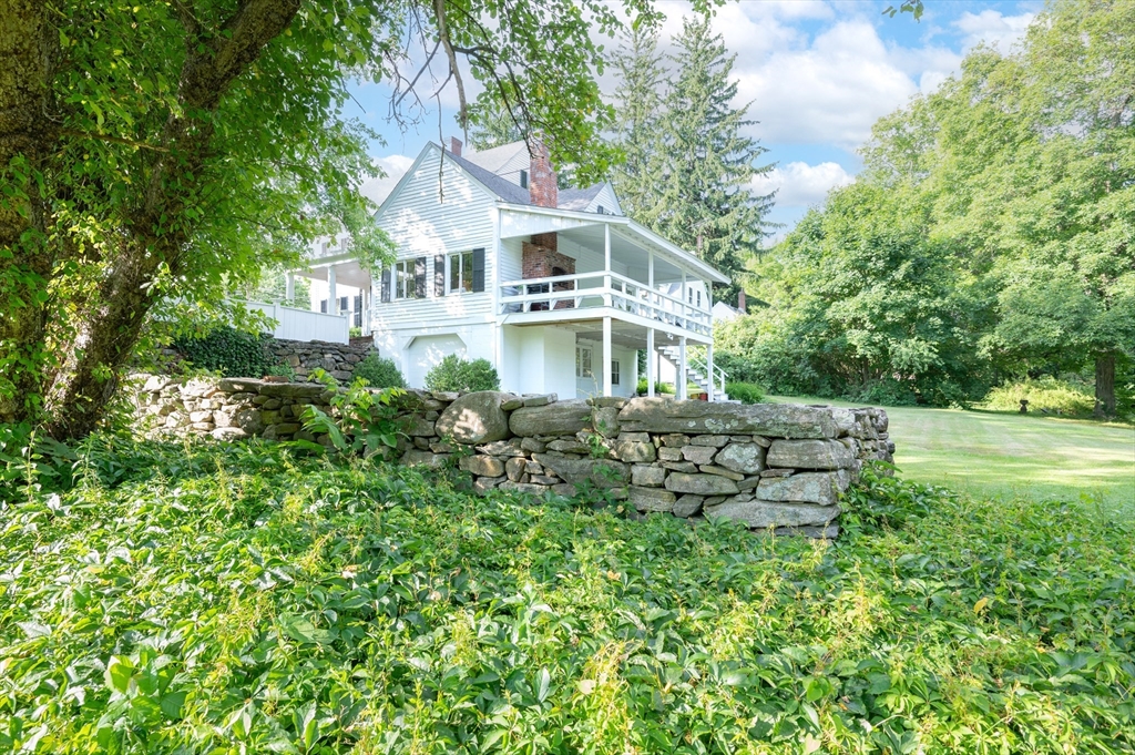 339 Boston Road Sutton, MA 01590 - Photo 25 of 28 a view of a house with a yard