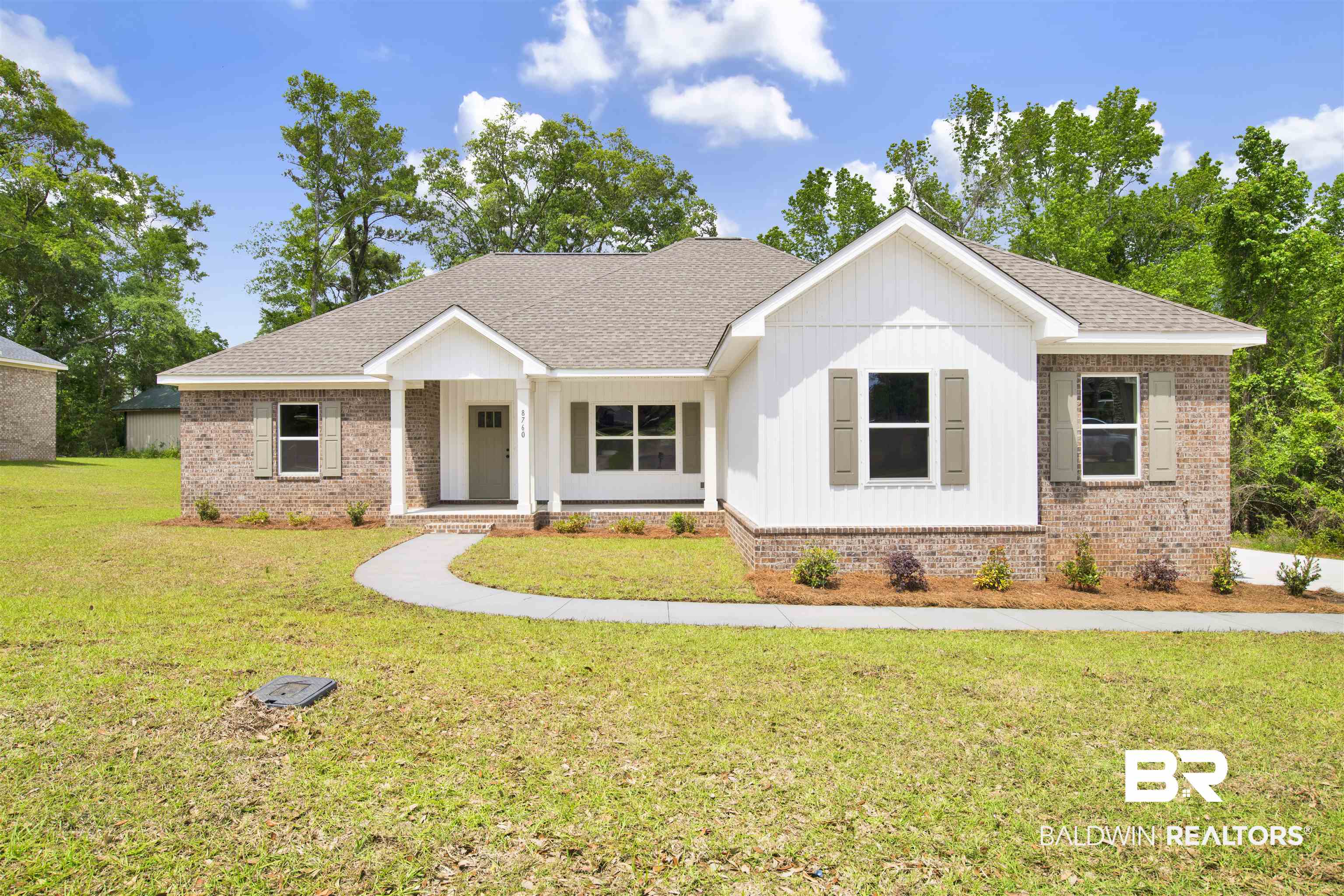 8760 Floyd Crabtree Way Semmes, AL 36575 - Photo 1 of 34 Single-story residence featuring a brick and vertical siding facade