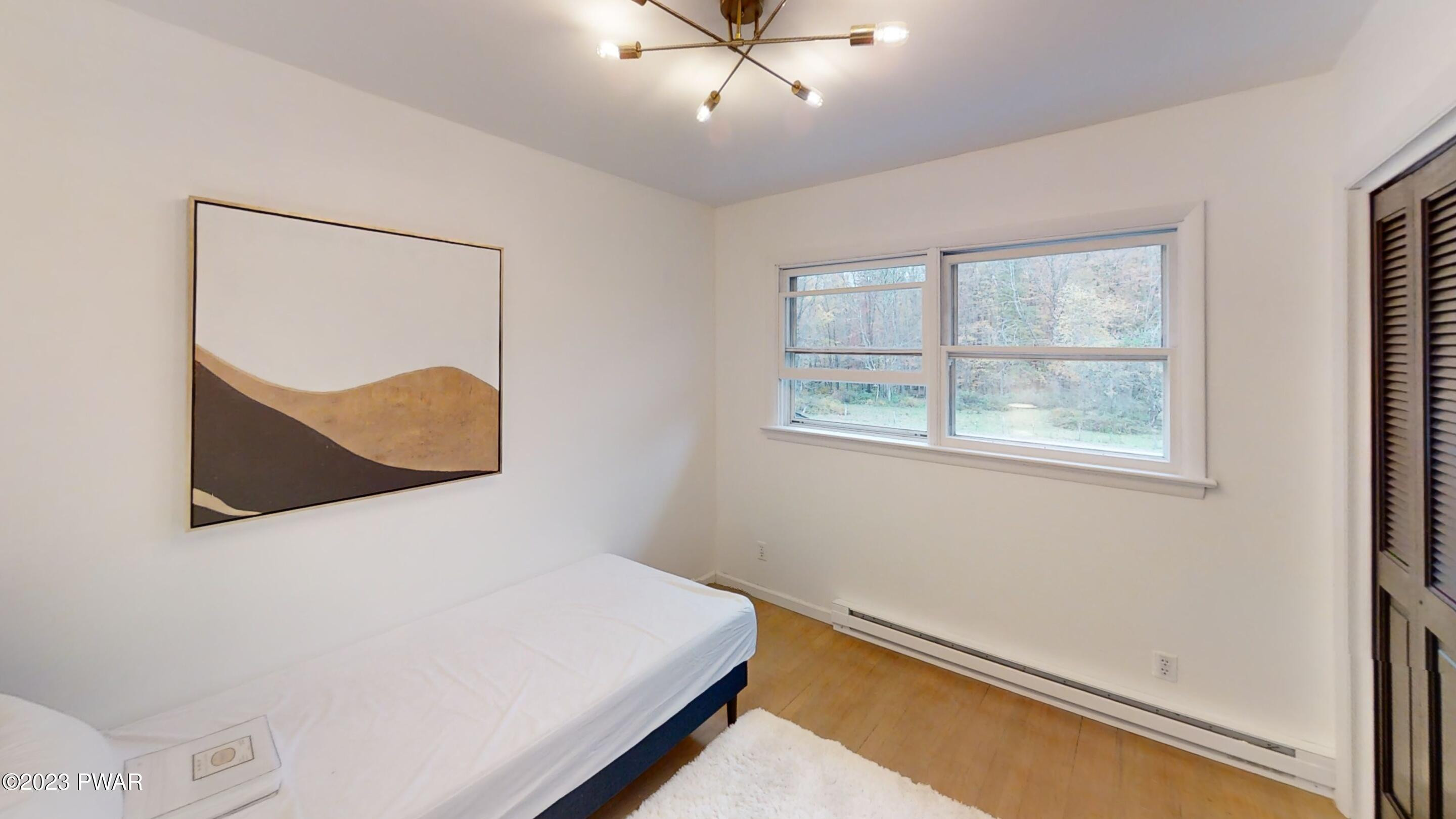 466 Old Gravity Road Lake Ariel, PA 18436 - Photo 21 of 35 a bedroom with a bed and a window