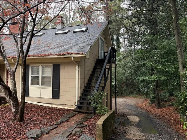 a view of a house with a tree
