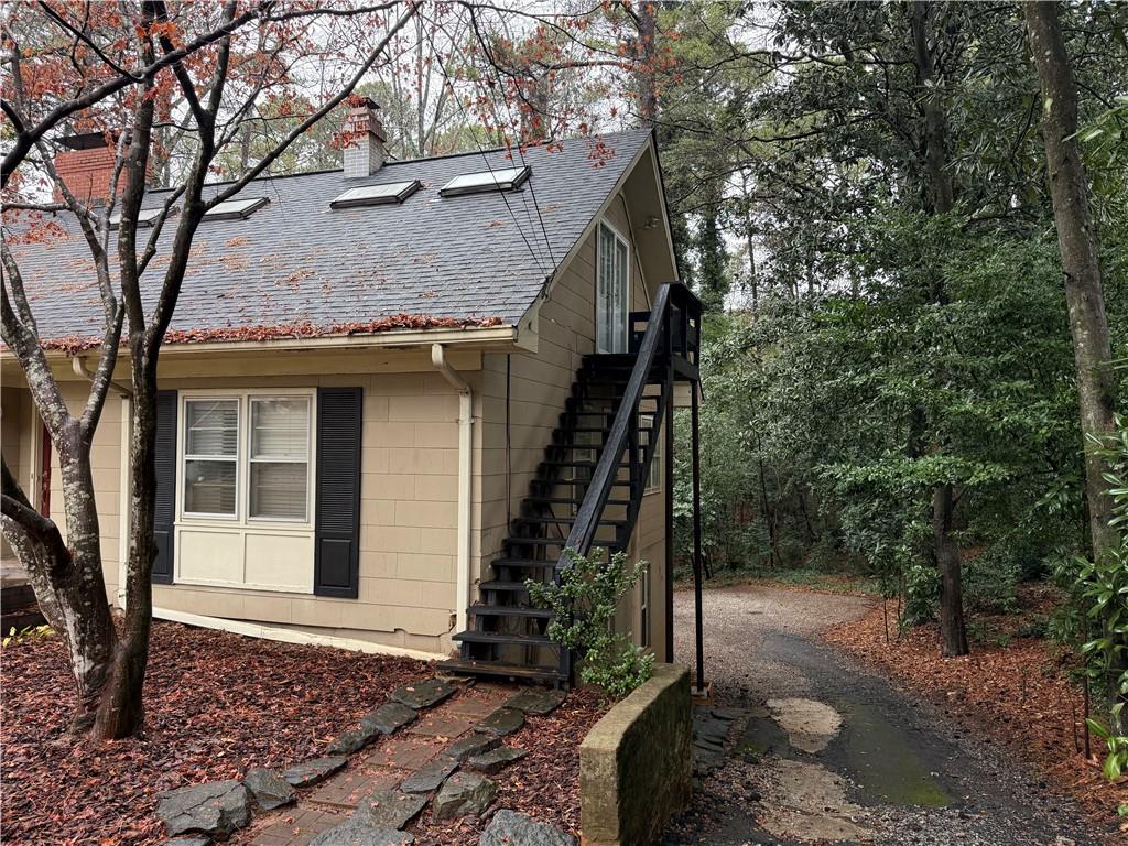 2035 Lyle Avenue, Unit A College Park, GA 30337 - Photo 2 of 12 a view of a house with a tree