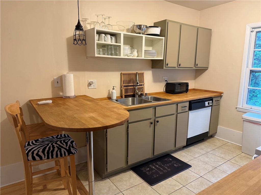 2035 Lyle Avenue, Unit A College Park, GA 30337 - Photo 5 of 12 a view of a kitchen with kitchen island a sink a counter space and appliances