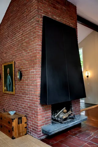 a kitchen with stainless steel appliances granite countertop a refrigerator a stove and a wooden floors