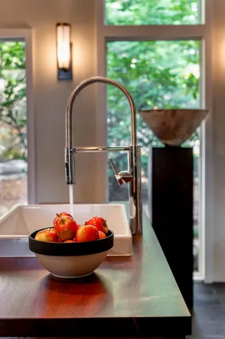 a bedroom with furniture and a window