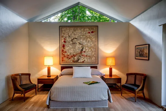 a view of living room filled with furniture and a potted plant