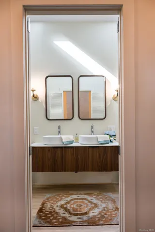 a bathroom with a bathtub sink and a shower