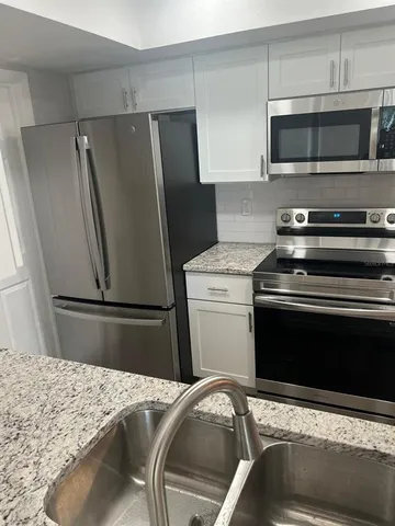 a view of storage and utility room with racks