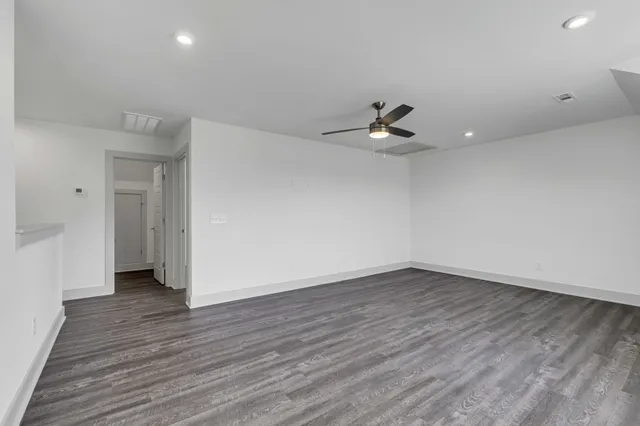 a view of a brick house with a yard