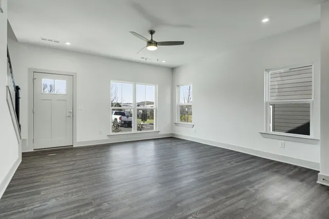 a kitchen with a sink cabinets and window