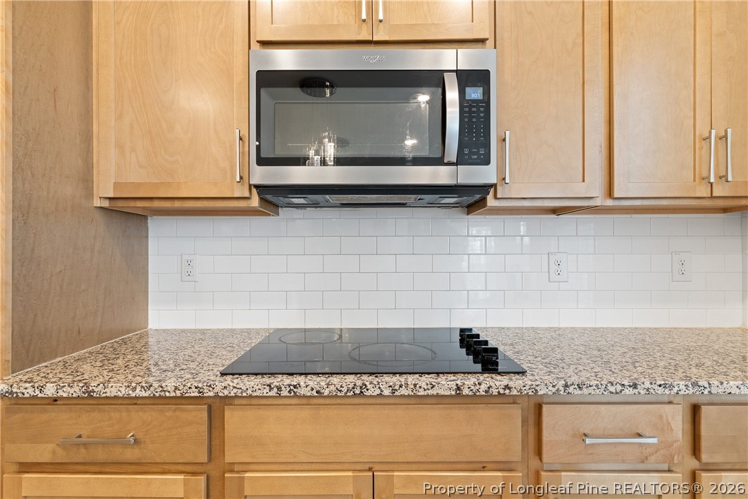 18 Two Belles Court Angier, NC 27501 - Photo 11 of 39 a kitchen with granite countertop white cabinets and a sink