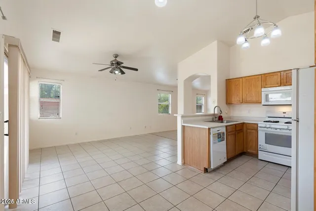 a kitchen with a stove cabinets and counter space