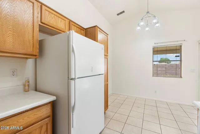 a white refrigerator freezer and a dishwasher in a kitchen