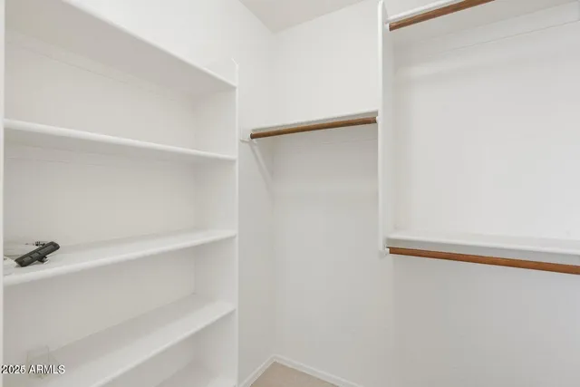 a spacious bathroom with a bathtub shower sink and mirror